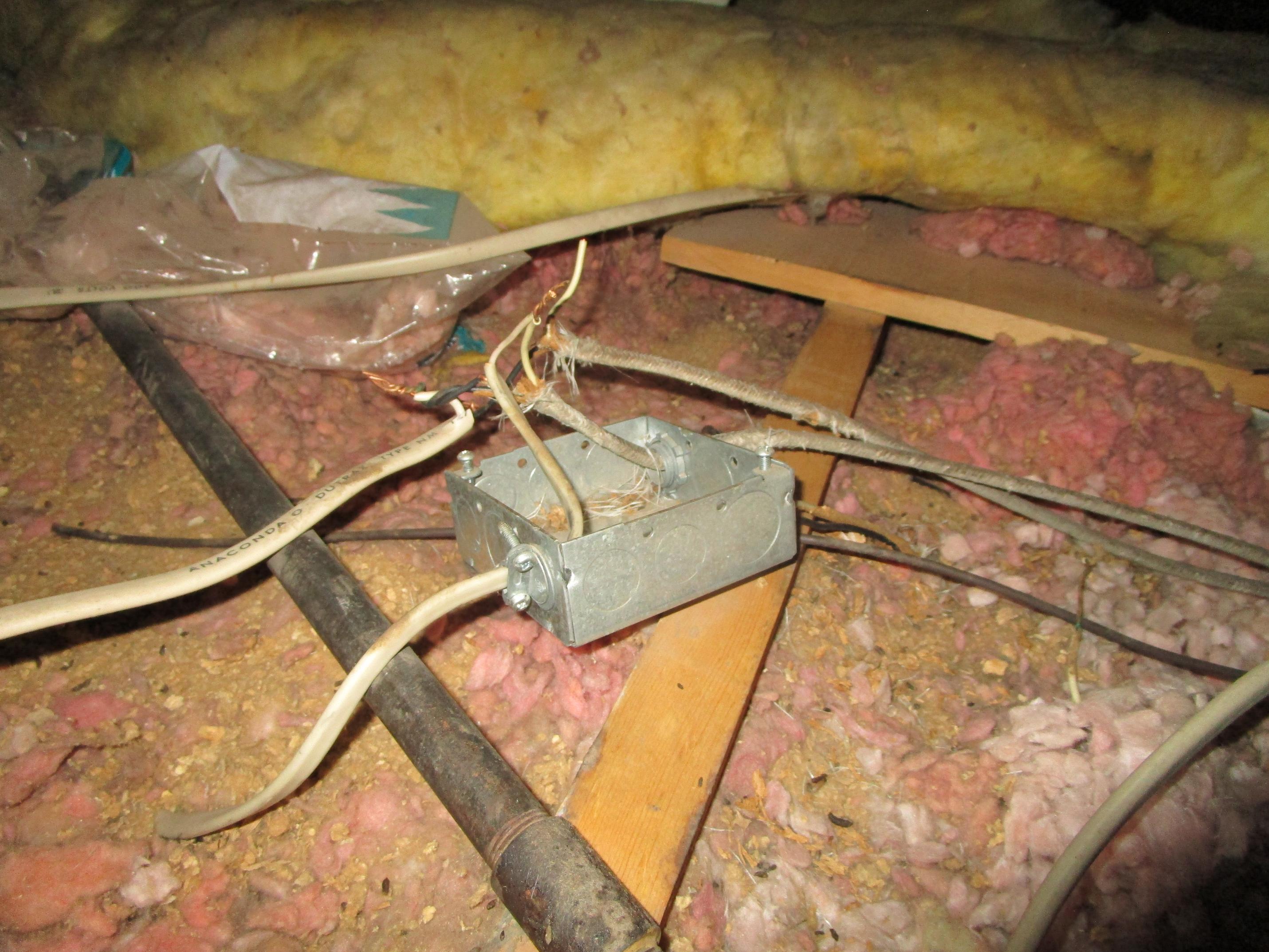 Exposed Electrical Wiring in Attic Creating a Significant Safety Hazard